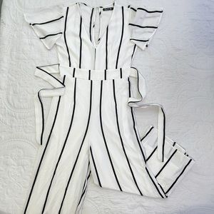 White jumpsuit with black stripes